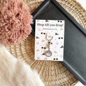 sleutelhanger met een muntje voor de winkelkar met opschrift:shop till you drop